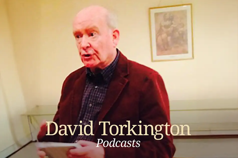 An older man in a brown jacket speaks while holding papers. A framed picture hangs on the cream wall behind him. The text David Torkington Podcasts is overlaid at the bottom of the image.